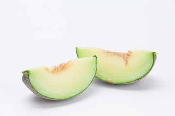Sliced green cantaloupe melon isolated on white background