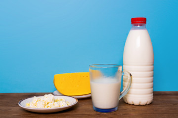 Jewish holiday - Shavuot. Dairy products and fruits over wooden table.