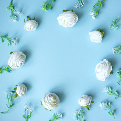 Abstract composition of spring flowers on blue  background.