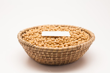 Blank paper with Soybeans in basket isolated on white background