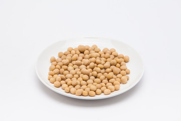 Round dish with soybeans isolated