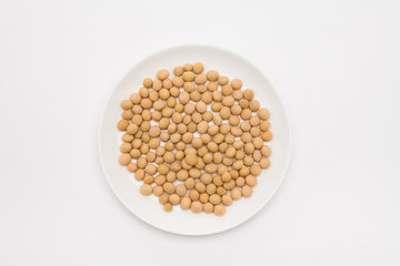 Round dish with soybeans isolated