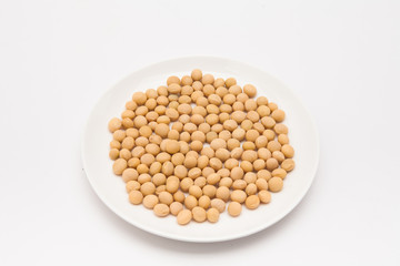 Round dish with soybeans isolated