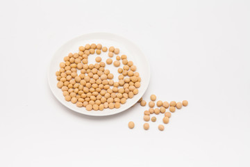 Round dish with soybeans isolated
