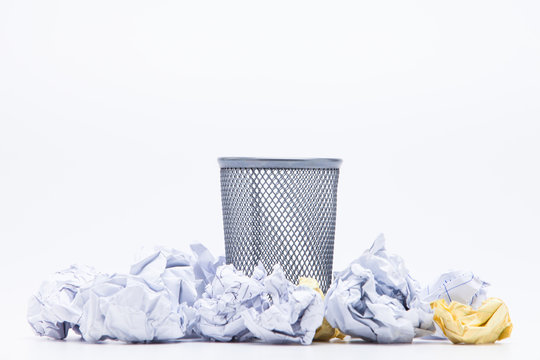 Wastepaper Basket With Papers Against White Background
