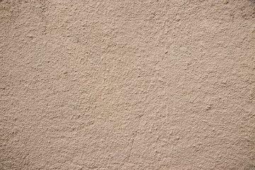 Beige stucco wall texture wide shot