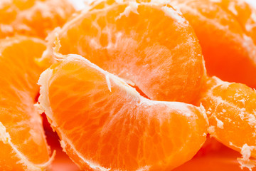 Peeled mandarin oranges on white background 