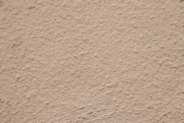 Beige stucco wall texture wide shot
