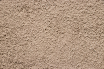 Beige stucco wall texture wide shot