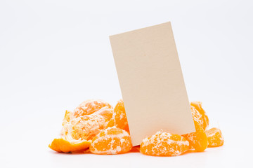 Fototapeta na wymiar Empty memo paper with peeled mandarin orange on white background