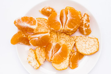Fototapeta na wymiar Peeled mandarin orange in white dish 