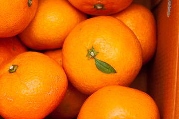 Close up of pile of fresh juicy mandarin oranges