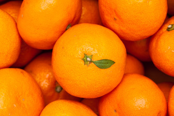Close up of pile of fresh juicy mandarin oranges
