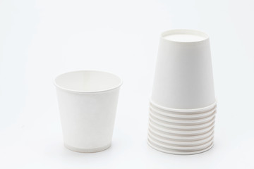 White paper cup and cups on white backbround