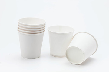 White paper cup and cups on white backbround