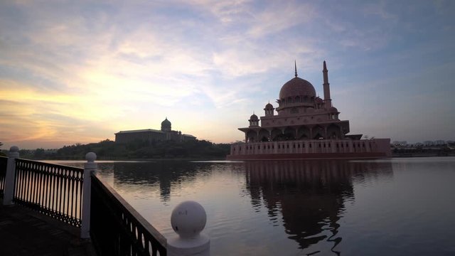 Establishing b-roll cinematic shot of Putra Mosque, Putrajaya Malaysia during sunrise. Muslim architecture and culture concept.