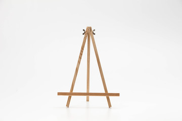Small wooden easel on a white background