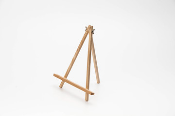 Small wooden easel on a white background
