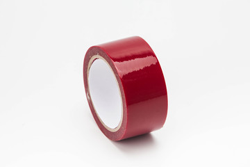 Red roll of duct tape isolated on white background