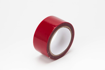 Red roll of duct tape isolated on white background
