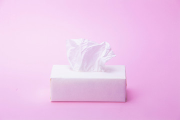Tissue box on pink background