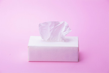 Tissue box on pink background
