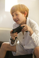 boy, kid, playing games with differen poses and attitudes, gamepad