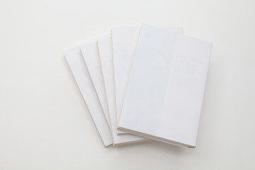 Stack of books on white background