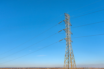 Transmission tower in a beautiful blue sky day