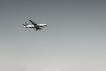 Black and White airplane departure flying in clear day