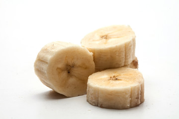 Peeled banana slices close up isolated