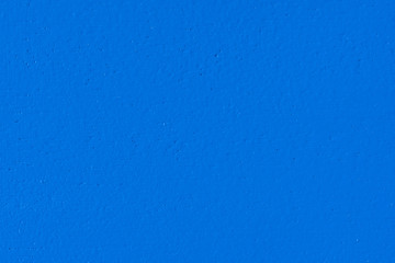Macro image of a royal blue painted wooden panel