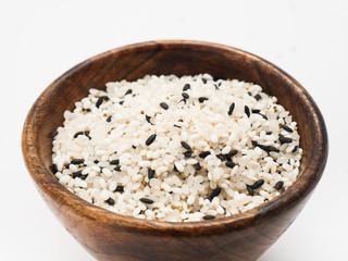 Miscellaneous grains, rice, black rice, brown rice in wooden bowl isolated