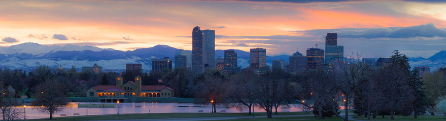 Denver skyline with colorful sunset and Mount Evans