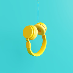 Yellow headphone with pastel blue background. 3d rendering