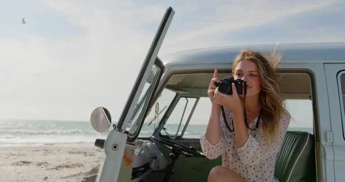 Woman taking photos with digital camera 4k