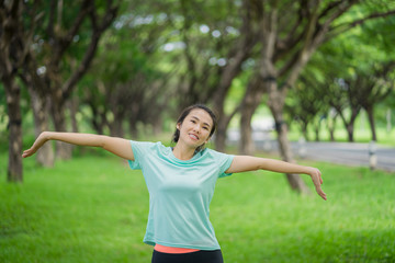 Beautiful asian woman is exercising in the park.