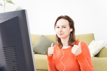 Online lesson teacher in front of computer