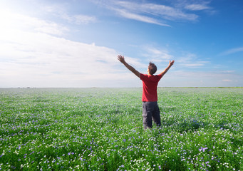 Man on green meadow