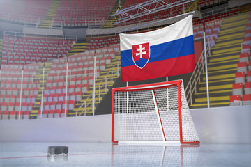 Flag of Slovakia in hockey arena with puck and net