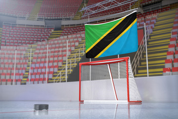 Flag of Tanzania in hockey arena with puck and net