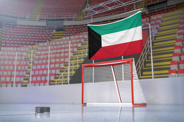 Flag of Kuwait in hockey arena with puck and net