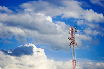 Obraz premium Cell tower on the background of beautiful clouds