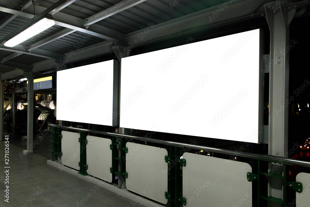 Wall mural two blank billboards situated at a train location. blank horizontal big poster in public place.