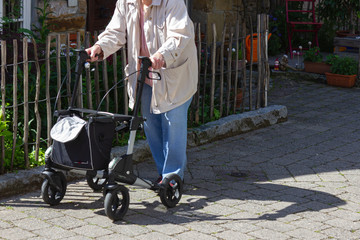 senior people walking with rollator