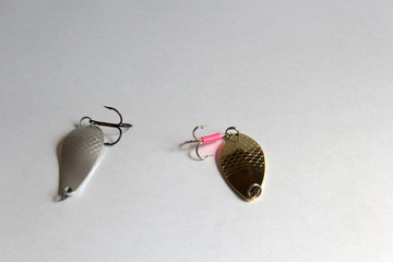 White and yellow rippled wavering baubles on a gray background