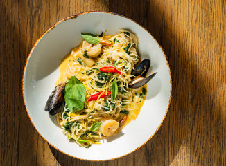 seafood pasta on the wooden background