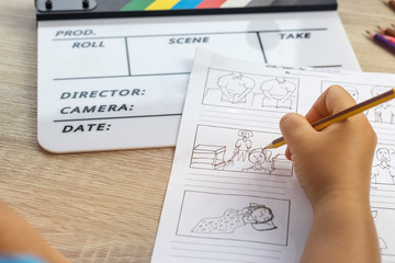 Storyboard drawing with pencil creative sketch cartoon. Storyboarding is process image displayed in sequence for purpose of pre-visualizing motion picture, interactive media. Concept sketching ideas.