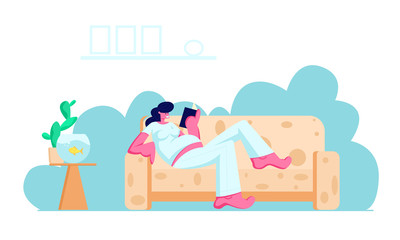 Young Pregnant Woman with Big Belly Lying on Comfortable Sofa Reading Book at Home
