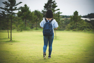 Happy young cute Asian Japanese girl hipster backpack women travelling looking at beautiful sky mountains scenery views 